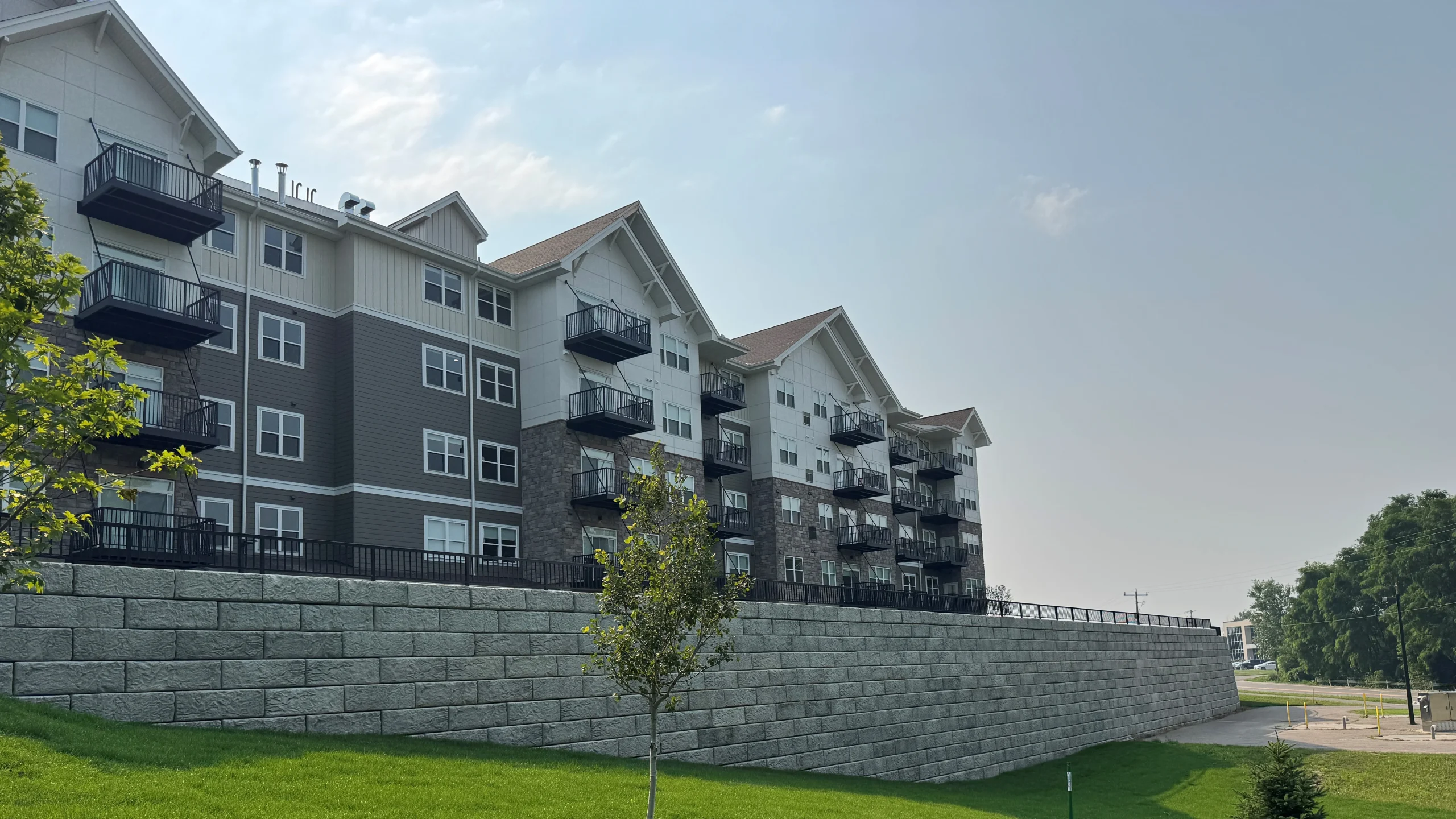 Reinforced soil wall supporting a residential real estate development