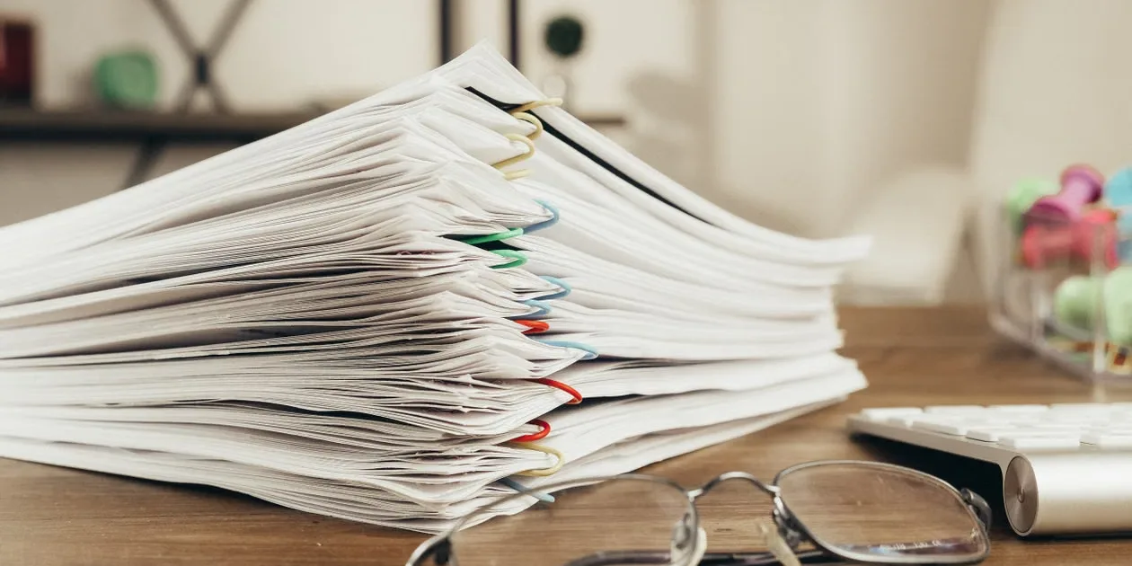 Resources - stack of documents on a desk